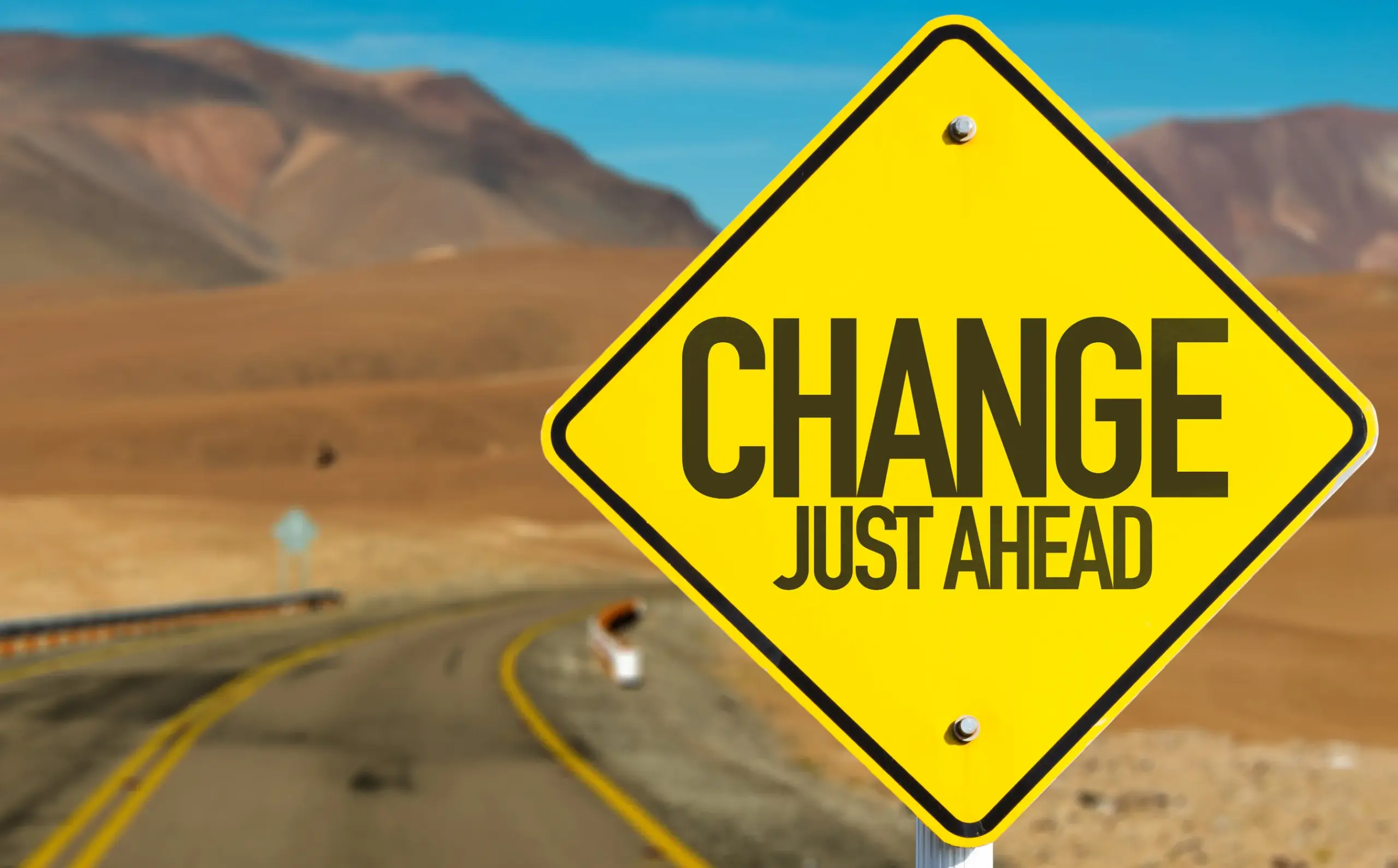 road_sign_showing_change_just_ahead