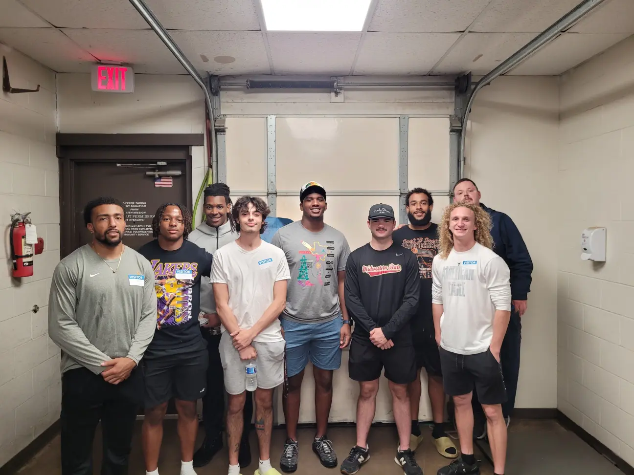 Picture MSU football players volunteering at Wichita Falls Faith Mission
