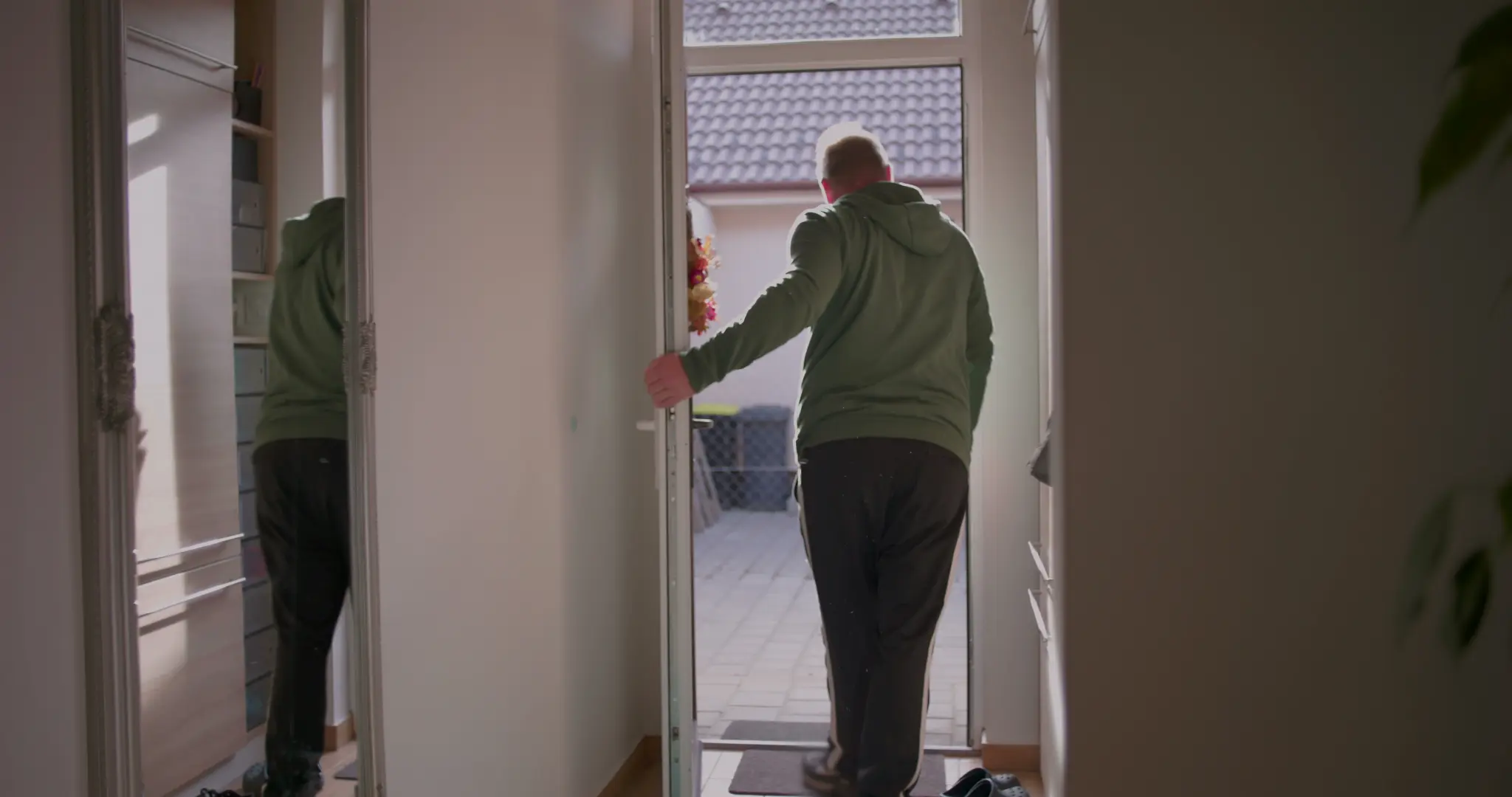 Man leaving out the door