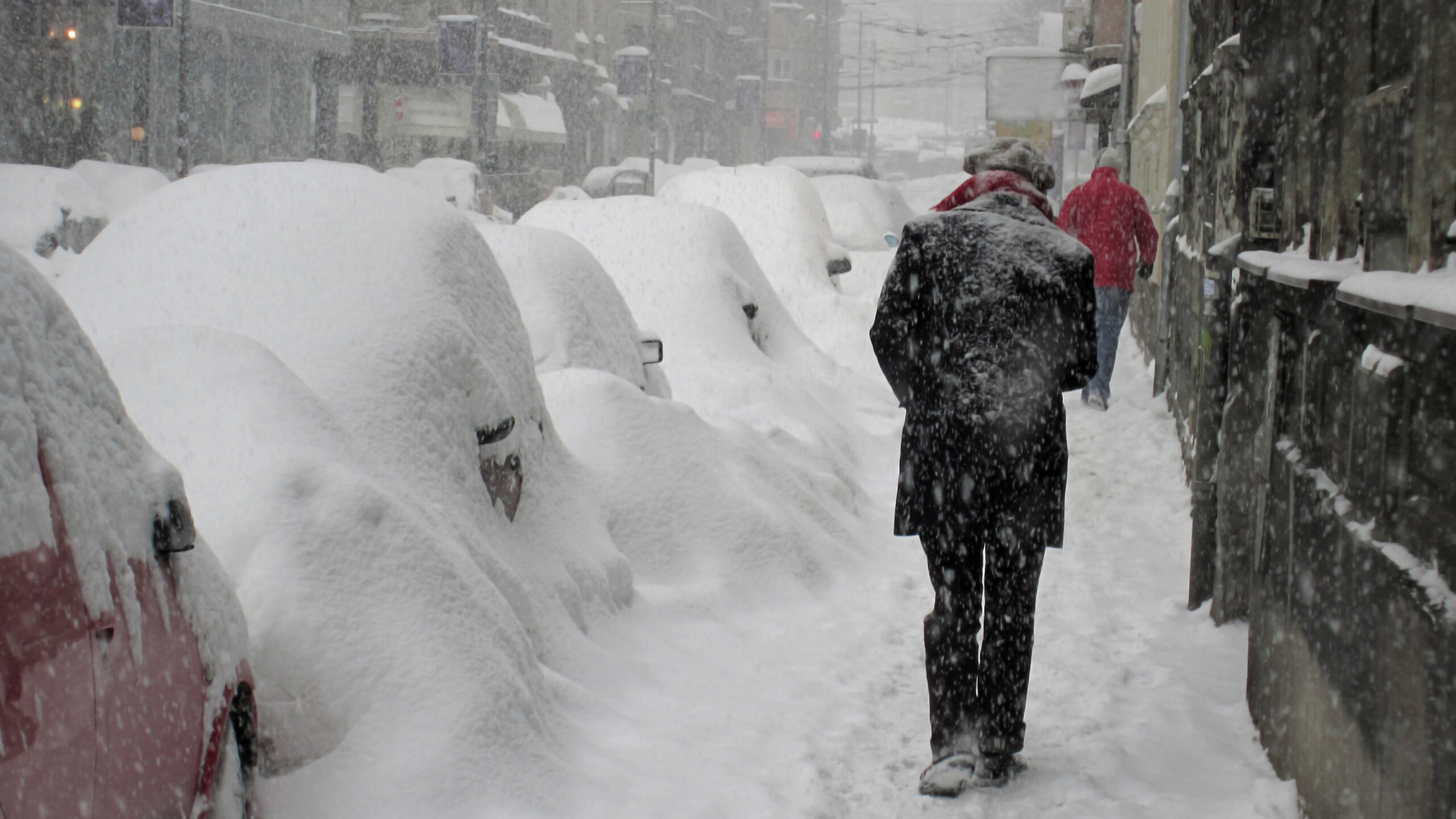 Picture of man walking in snowstorm